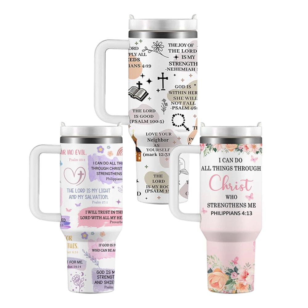 Three Christian-themed tumblers with white handles, featuring Bible verses and decorated with floral, heart, and cross designs in soft pastel colors.