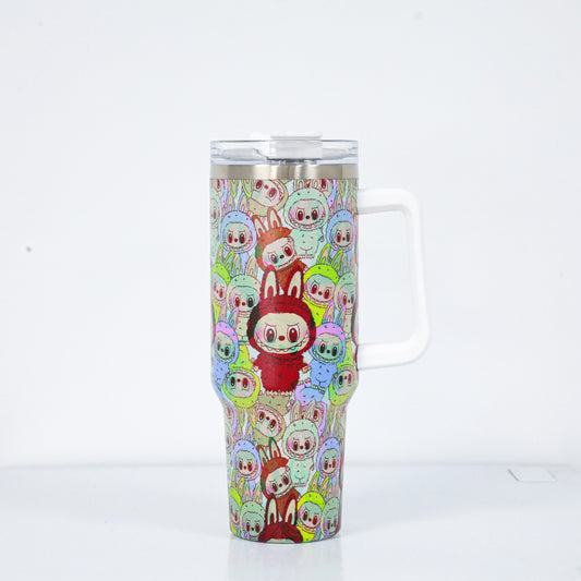 A stainless steel tumbler with a white handle, covered in a dense pattern of colorful Labubu characters dressed in bunny suits, with a central red bunny standing out.